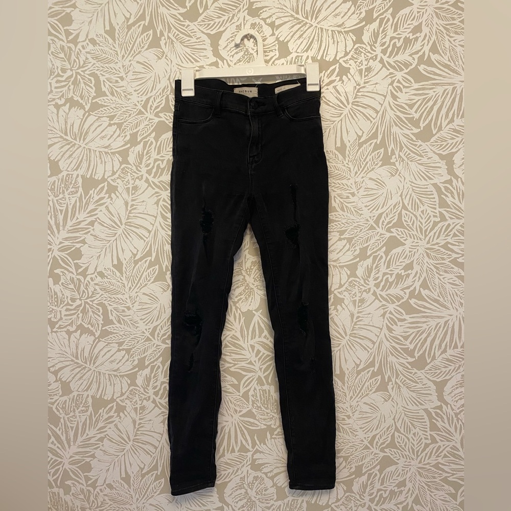Black ripped skinny jeans.